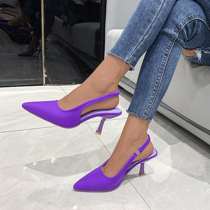 Stylish women's black slingback dress shoes with a pointed toe, perfect for formal occasions.