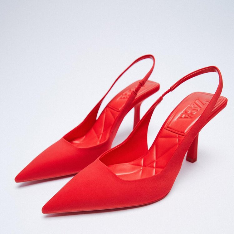 Fashionable women's slingback pumps with a contemporary block heel. Elegant and comfortable dress shoes.