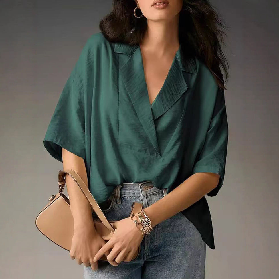 Chic V-neck workwear blouse for women. Elegant long sleeve top with a comfortable loose fit.