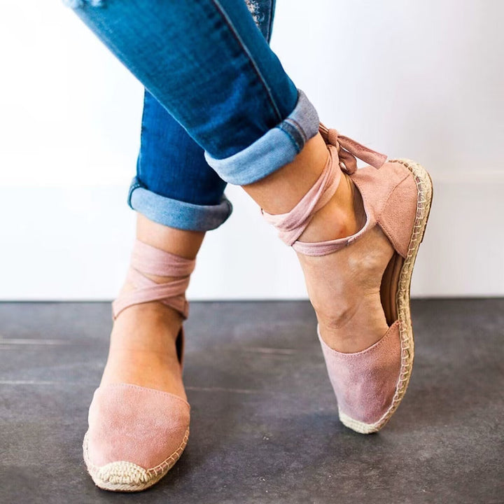 Elegant women's tie-strap espadrille sandals in a stylish design, offering comfort for summer casual wear.