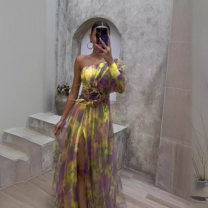 Long women's formal dress featuring a glamorous asymmetric floral pattern & one-shoulder neckline for special occasions.