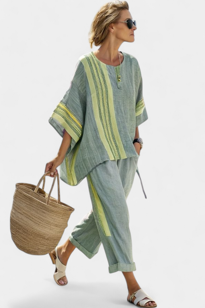 Trendy women's striped set, featuring a chic top and relaxed fit pants for comfortable summer wear.