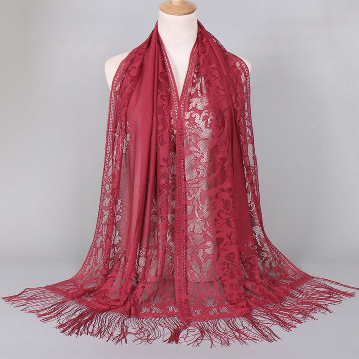 Elegant women's floral lace shawl with delicate fringed edges, versatile fashion accessory.