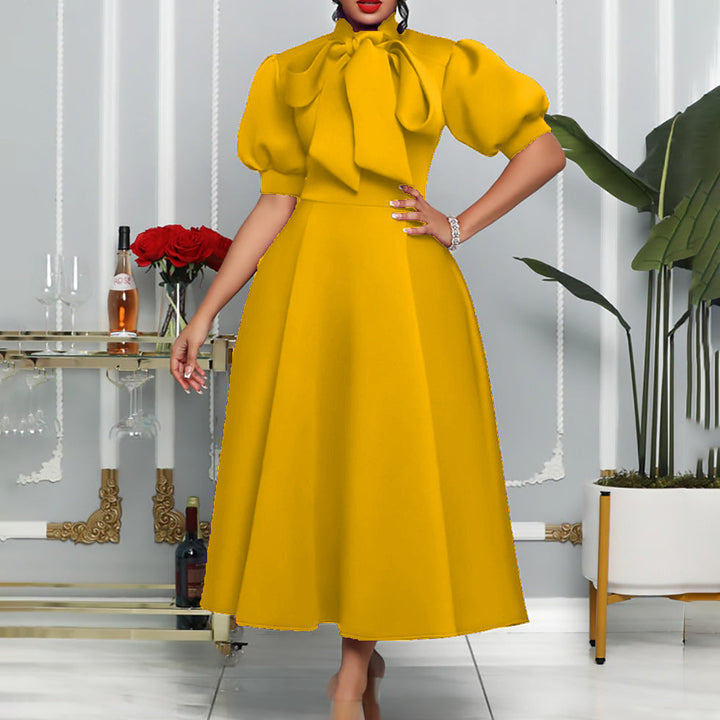 Stylish women's elegant maxi dress, with voluminous puff sleeves & a chic bow neckline, great for any event.