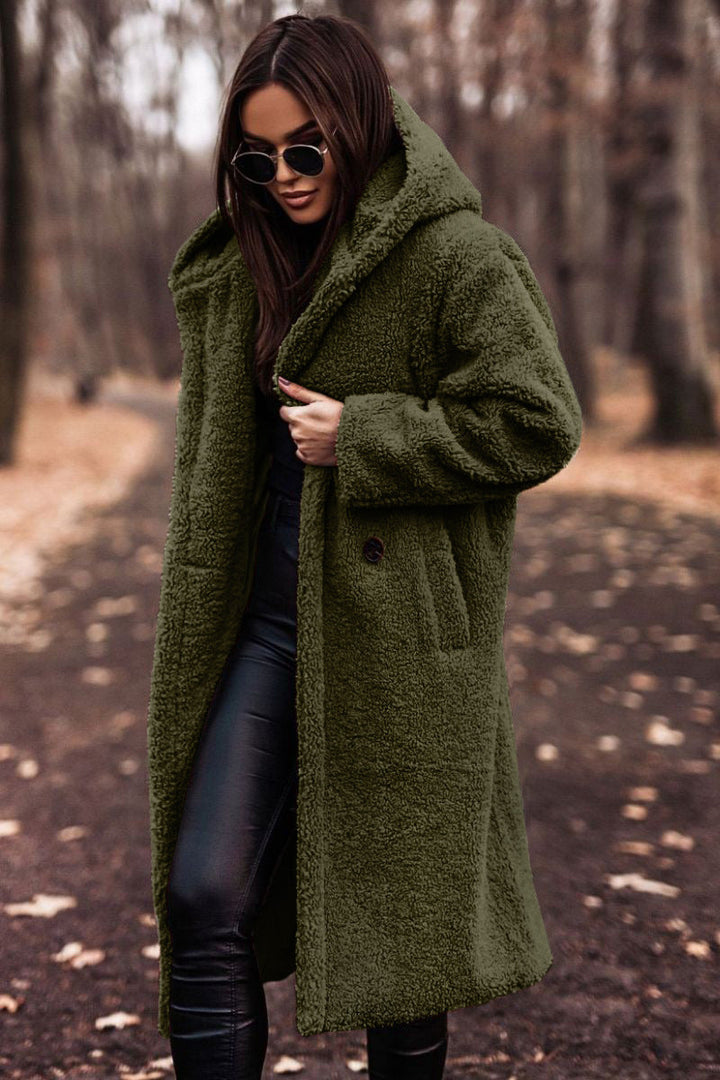 Soft plush hooded longline coat for women, ensuring cozy warmth during cold winter days.