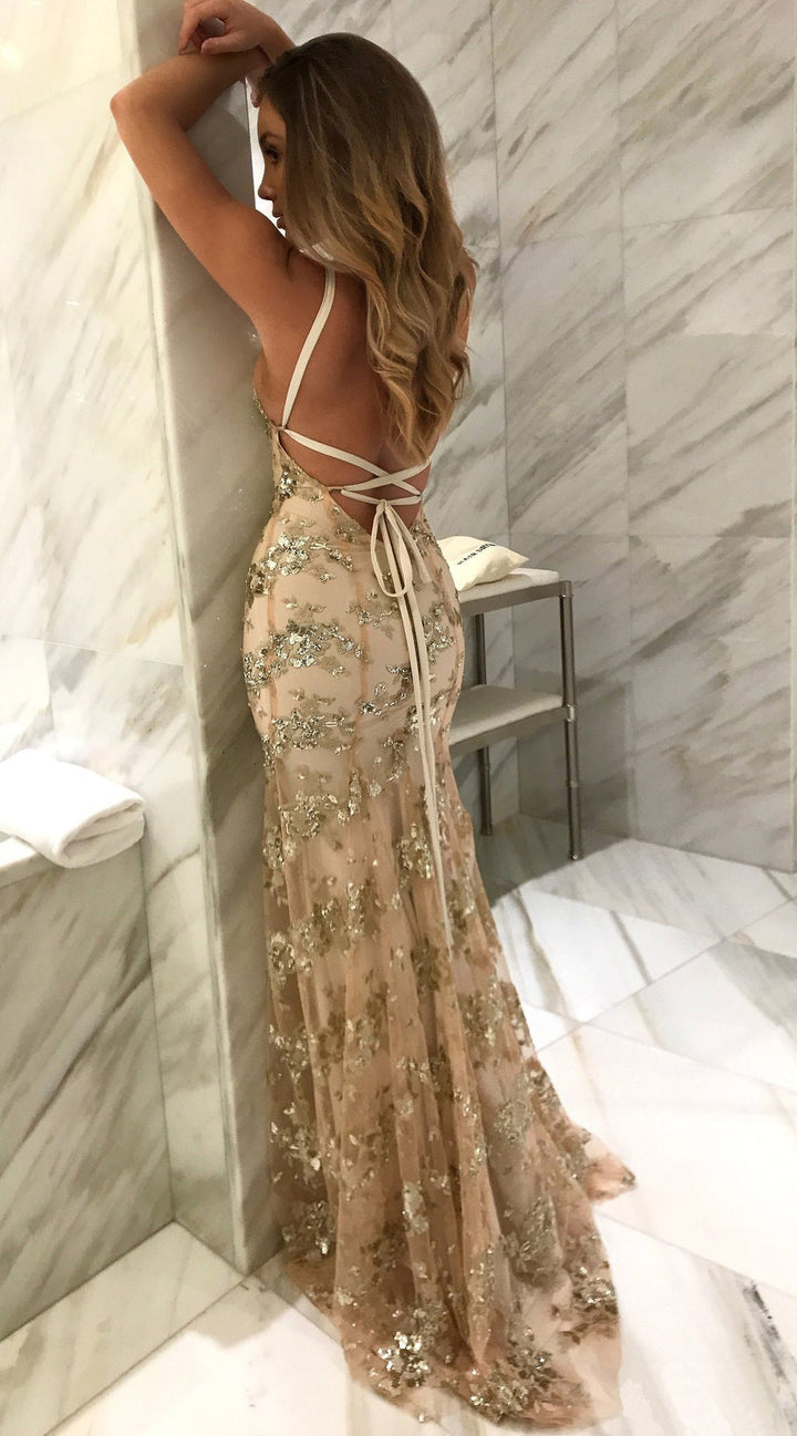Dazzling women's cocktail dress with a sparkling finish, deep back, and chic front slit for parties.