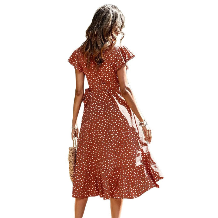 Flattering women's polka dot wrap dress featuring a playful skirt & comfort fit for summer days.
