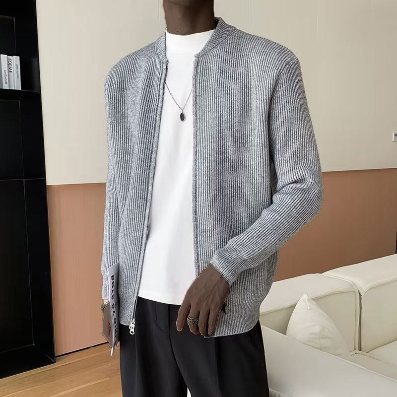 Modern men's ribbed zip-up sweater. Stand collar & long sleeves provide fashionable comfort for layering in cold weather.