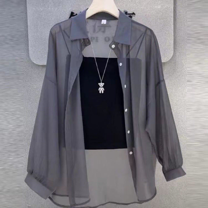 Women's sheer button-down layered tunic. Elegant long-sleeve blouse for versatile spring & summer fashion.