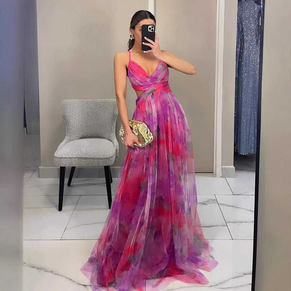 Graceful women's floral print maxi dress with spaghetti straps & V-neck, ideal for elegant evening events.