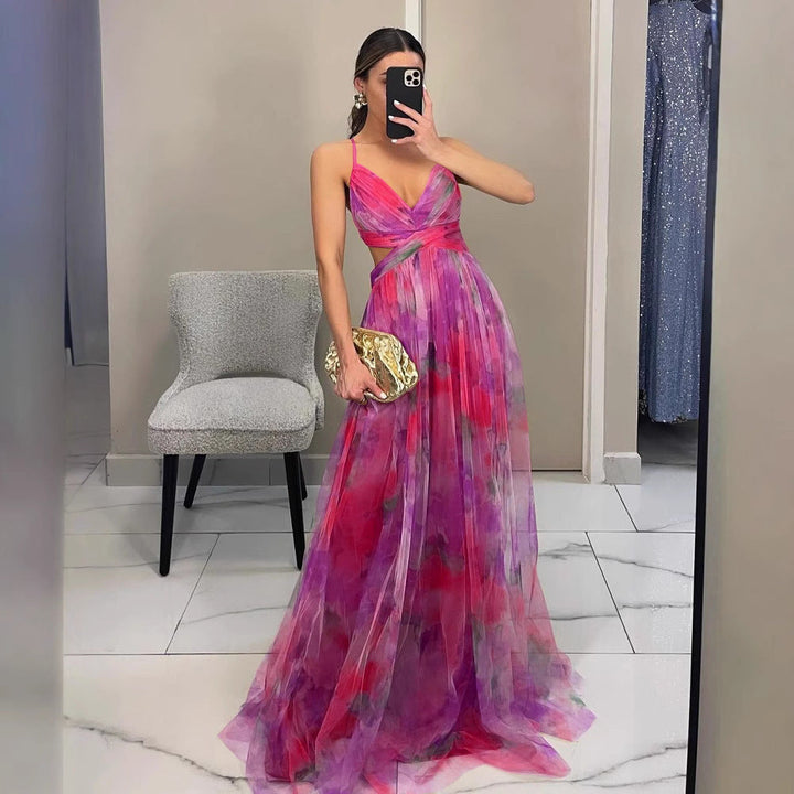 Graceful women's floral print maxi dress with spaghetti straps & V-neck, ideal for elegant evening events.