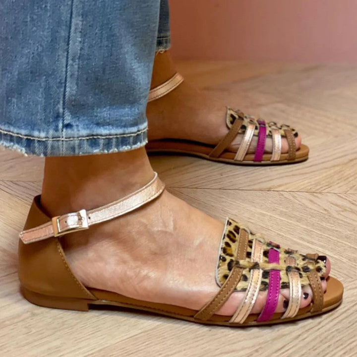Women's leopard print flat sandals with comfortable multi-straps, ideal for stylish summer casual wear and travel.
