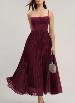 Flowing women's pleated maxi dress with a supportive bustier top, offering an elegant look for evening and summer events.
