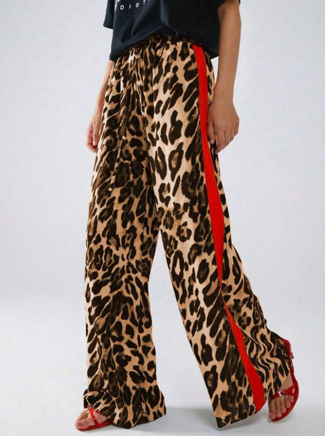 Chic women's wide-leg leopard print pants with a trendy side stripe detail. Loose fit ensures comfort & style.