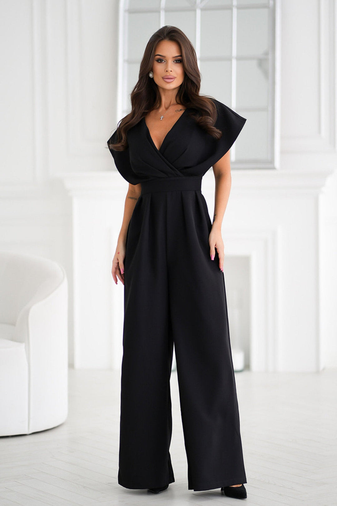Fashionable apricot women's jumpsuit featuring a flattering V-neck and trendy wide-leg silhouette.