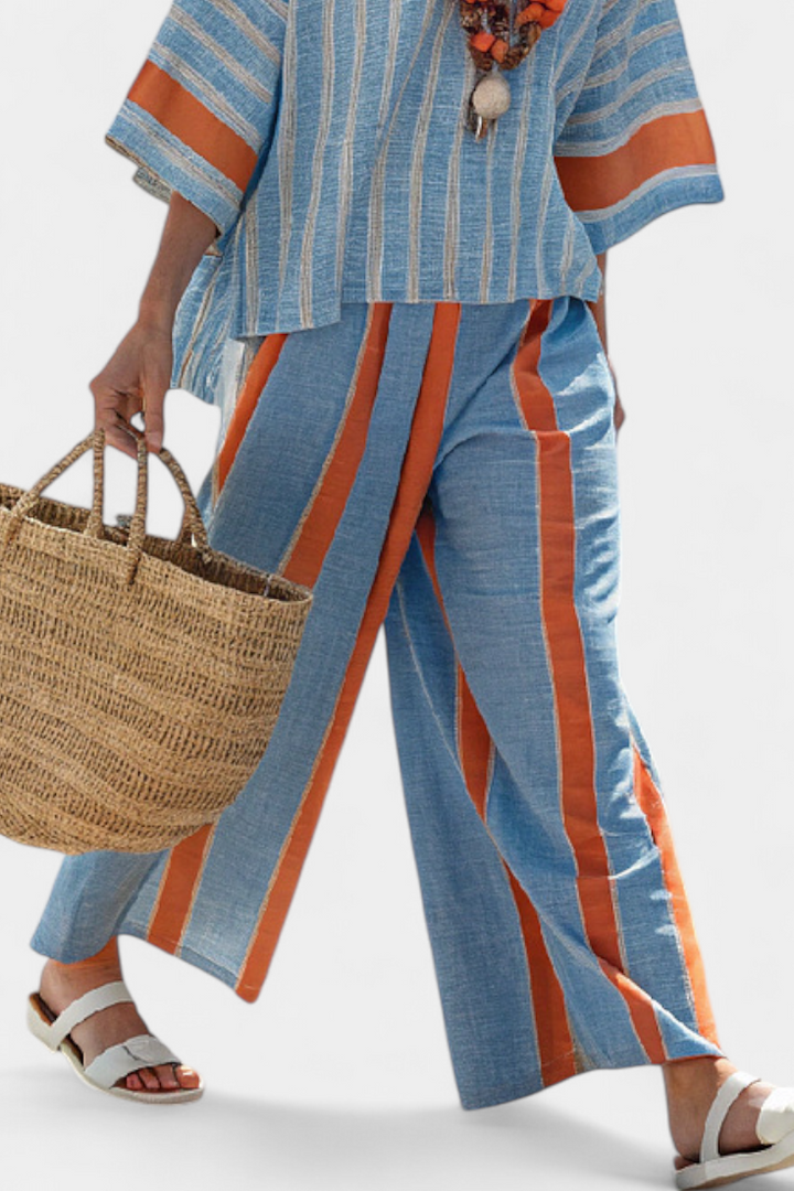 Casual chic women's terracotta striped two-piece set, ideal for summer style or a vacation outfit. Relaxed top & trousers.