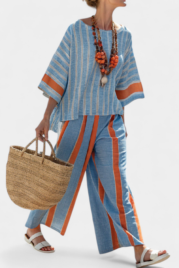 Women's terracotta striped top & wide-leg trousers set. Sophisticated two-piece for relaxed summer wear and vacation.