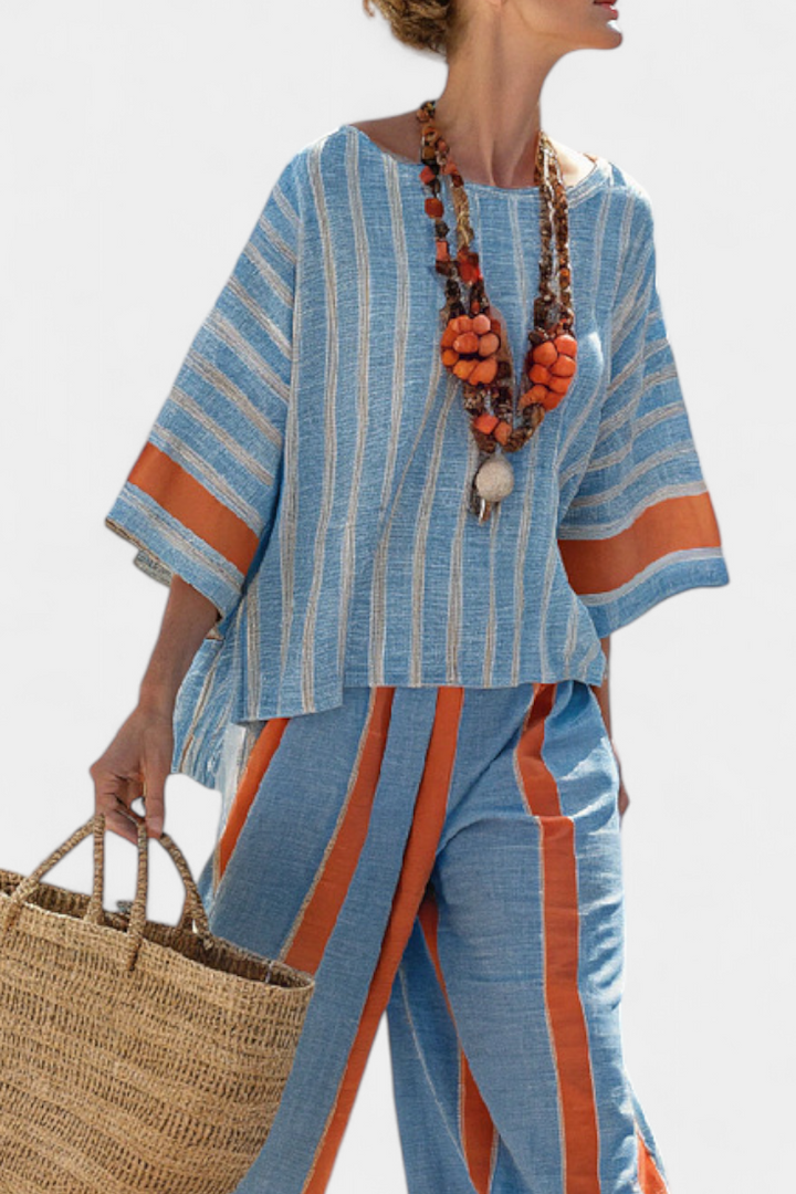 Elegant women's co-ord set featuring a striped top & comfortable terracotta trousers. Perfect casual chic two-piece outfit.