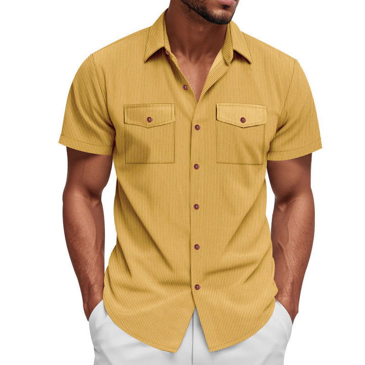 Relaxed fit men's striped short sleeve shirt, featuring two chest pockets. Ideal for comfortable everyday fashion.