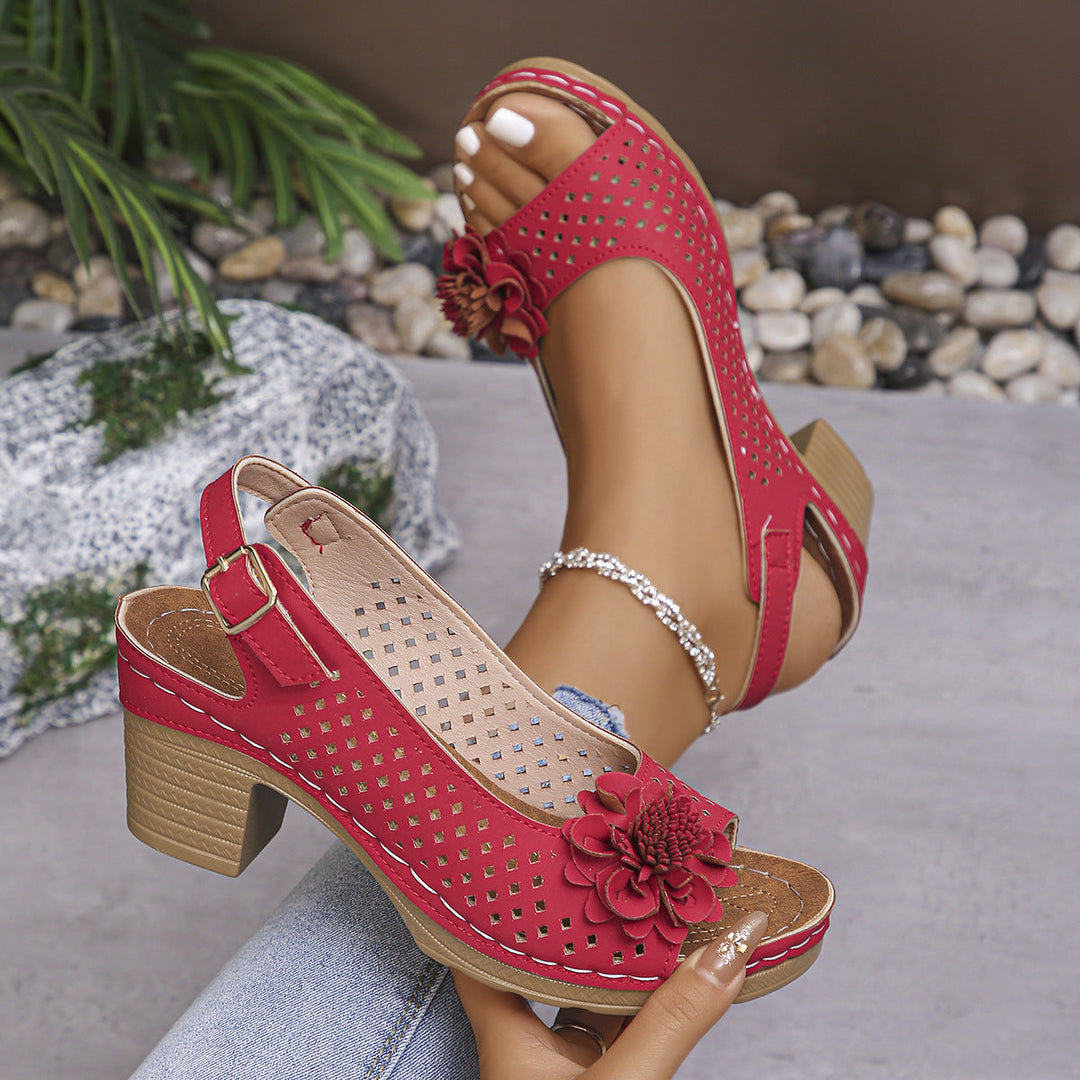Elegant women's fashion sandals with a chic floral design, perfect for summer casual or dressy occasions.