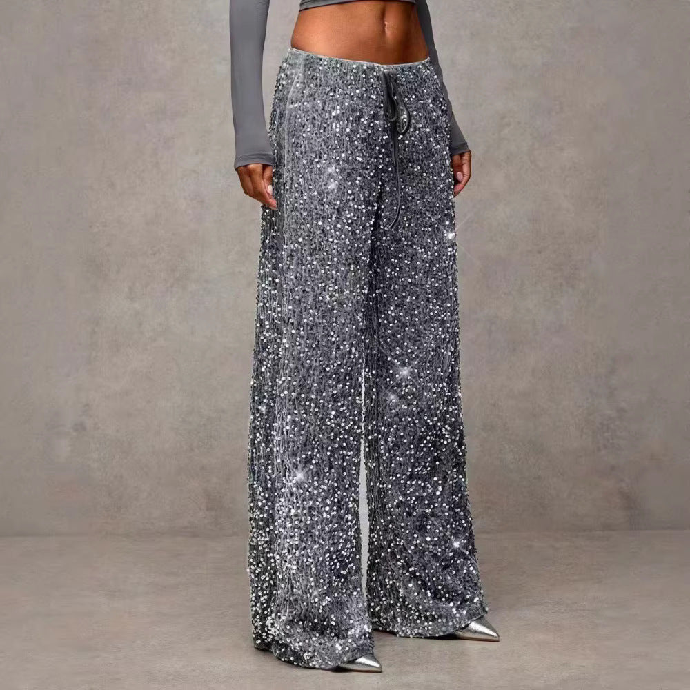 Comfortable women's sequin palazzo pants, high-waist design for formal or evening attire.