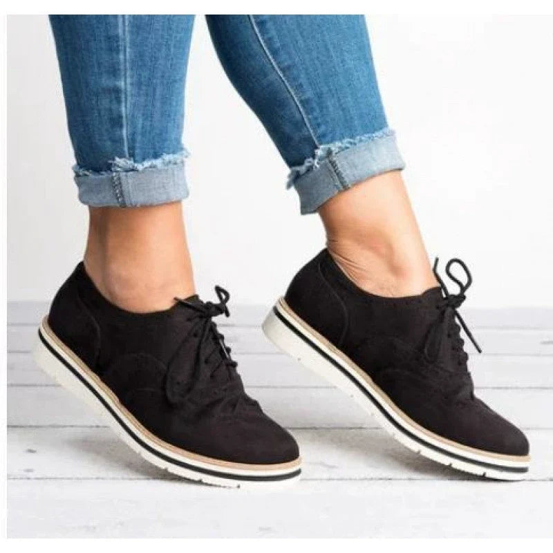 Versatile women's brogue shoes, a blend of classic footwear and modern elegance with perforated details.