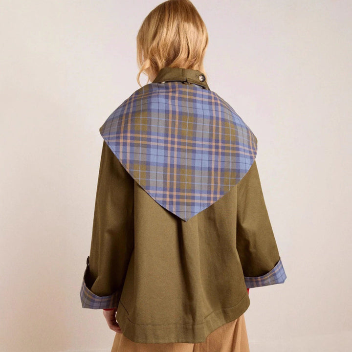 Elegant women's brown trench coat, a fashionable long jacket designed for a sophisticated look.