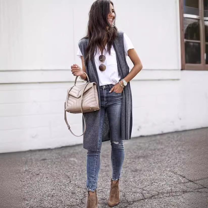 Chic women's long vest, sleek fabric & modern design. Versatile sleeveless outerwear for stylish layering.