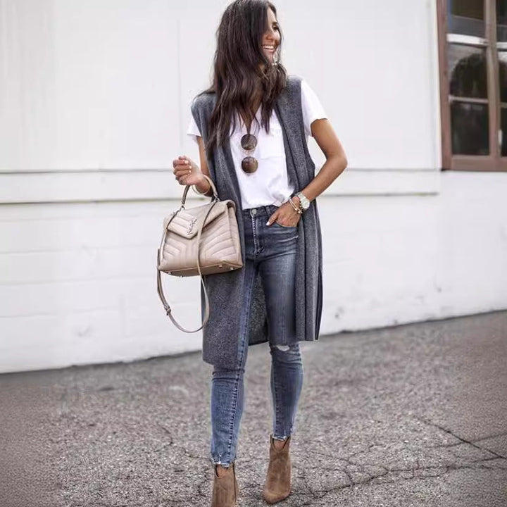 Chic women's long vest, sleek fabric & modern design. Versatile sleeveless outerwear for stylish layering.