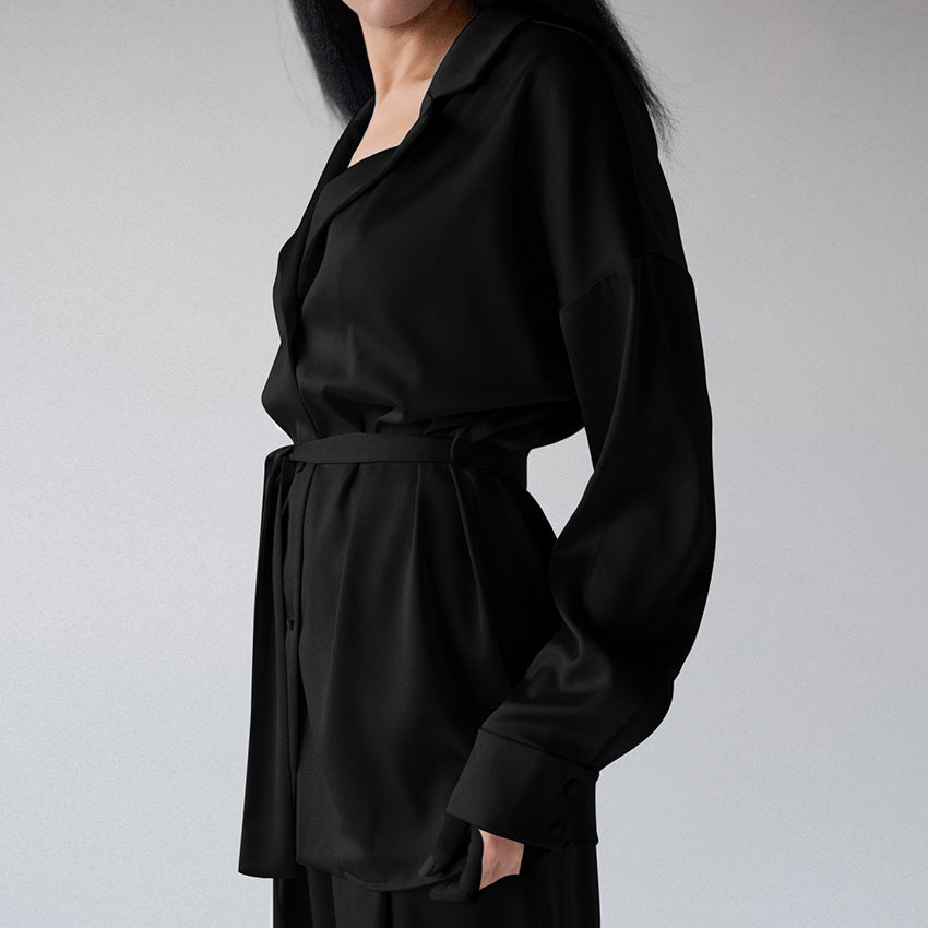 Stylish women's loose fit blouse & trousers two-piece suit set, an elegant and comfortable outfit.