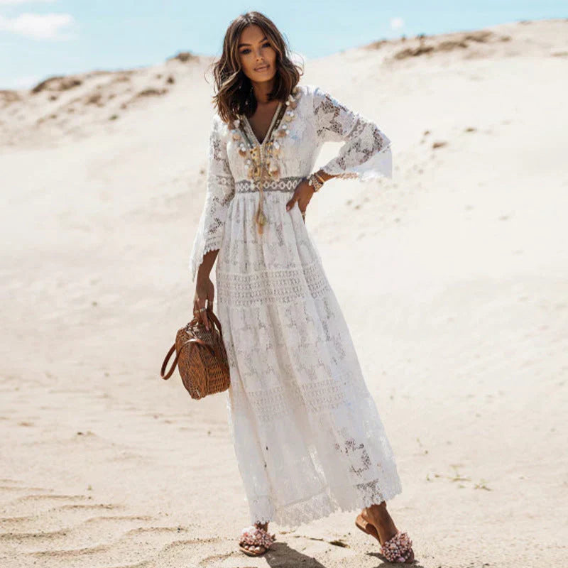 Bohemian style maxi dress for women. Features long sleeves and a flowy silhouette. Great for beach or casual wear.