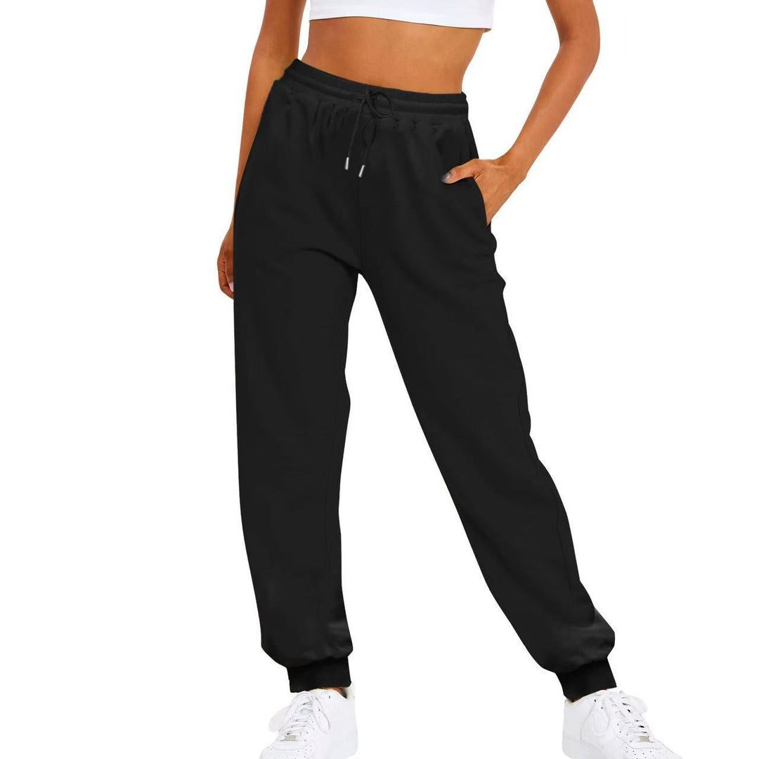 Women's joggers with spacious side pockets & comfortable elastic waist, perfect for carrying essentials.