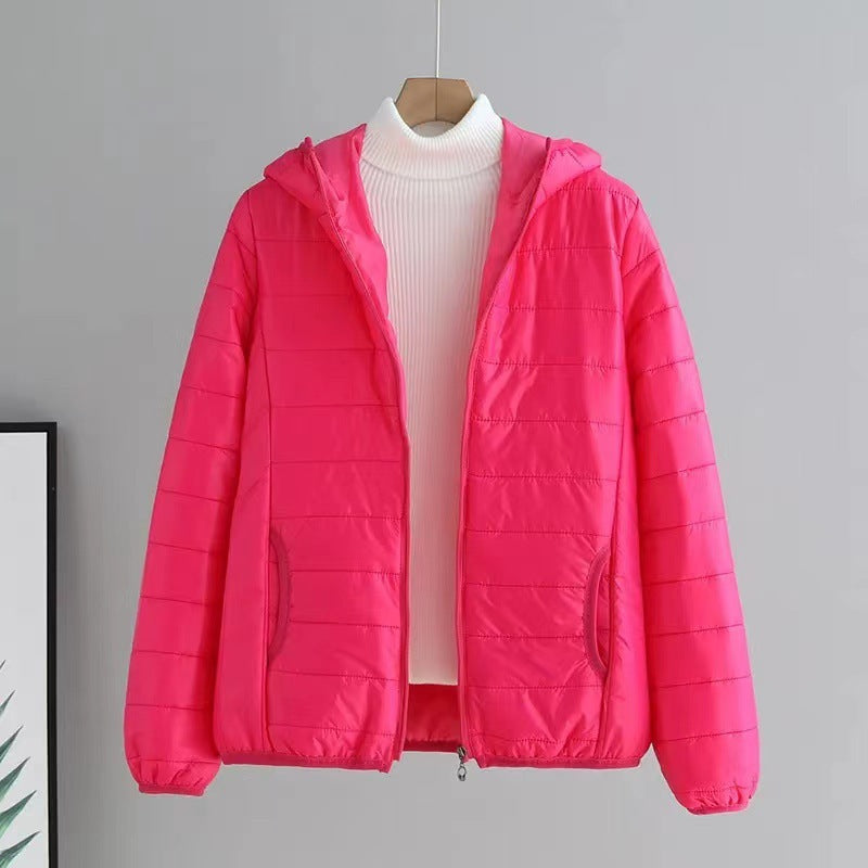 Chic ladies quilted jacket with hood, perfect for layering during cool spring or fall days.