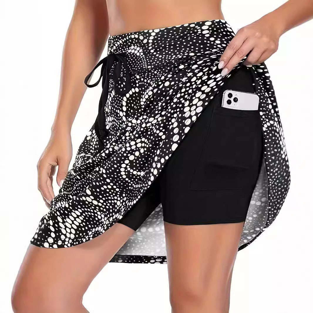 Quick-dry athletic skirt for women, featuring built-in compression shorts & convenient pockets. Great for running & workouts.