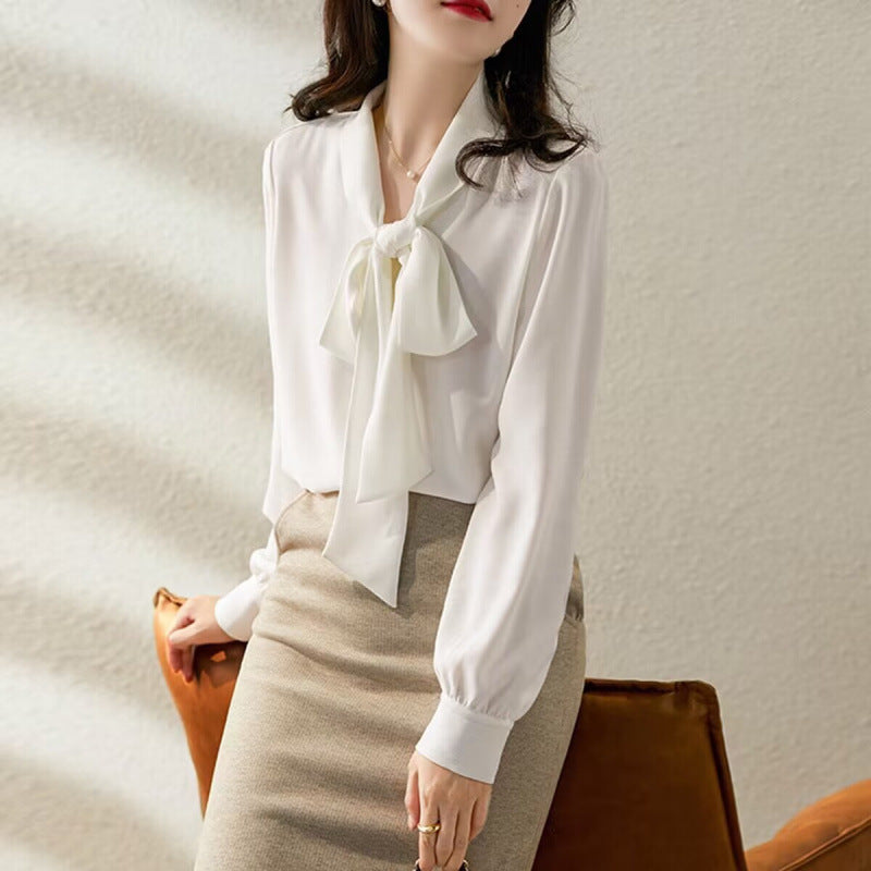 Elegant women's white bow blouse, long sleeve, chic office wear top for a sophisticated look.