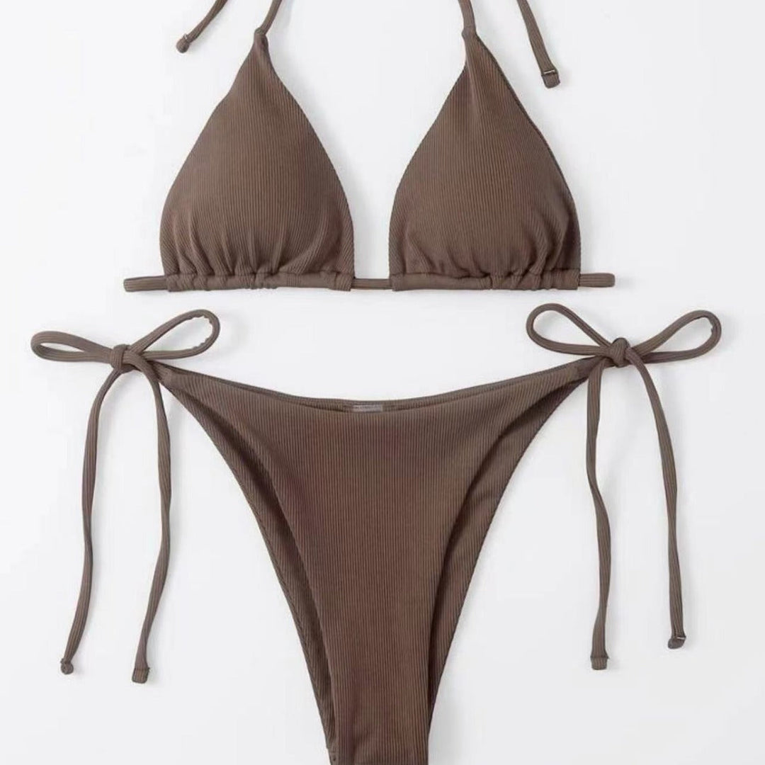Close-up: Striped tie-front bikini top, showing adjustable design & ribbed texture. Women's swimwear.