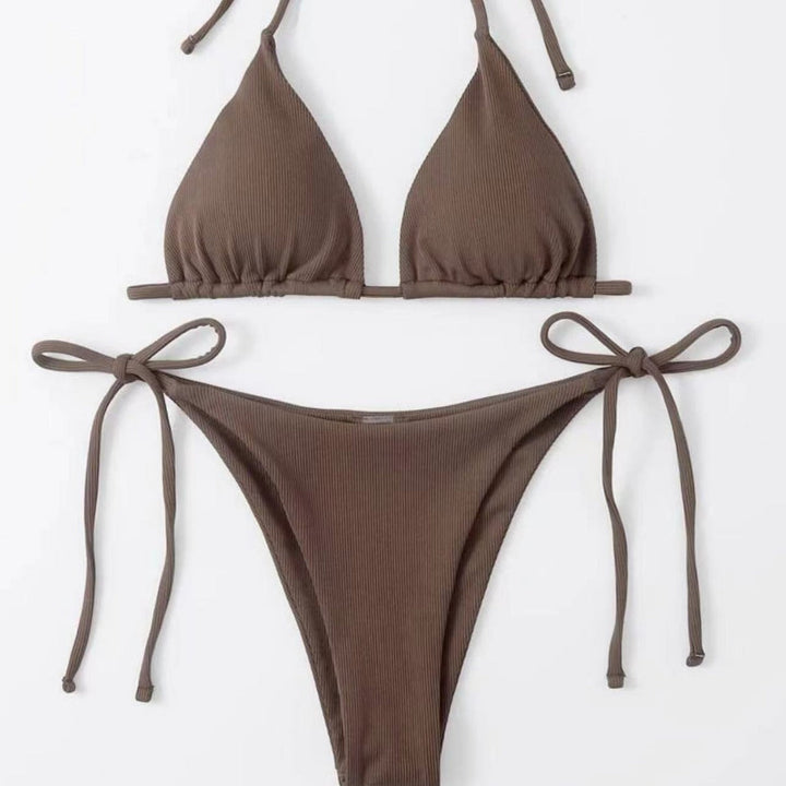 Close-up: Striped tie-front bikini top, showing adjustable design & ribbed texture. Women's swimwear.