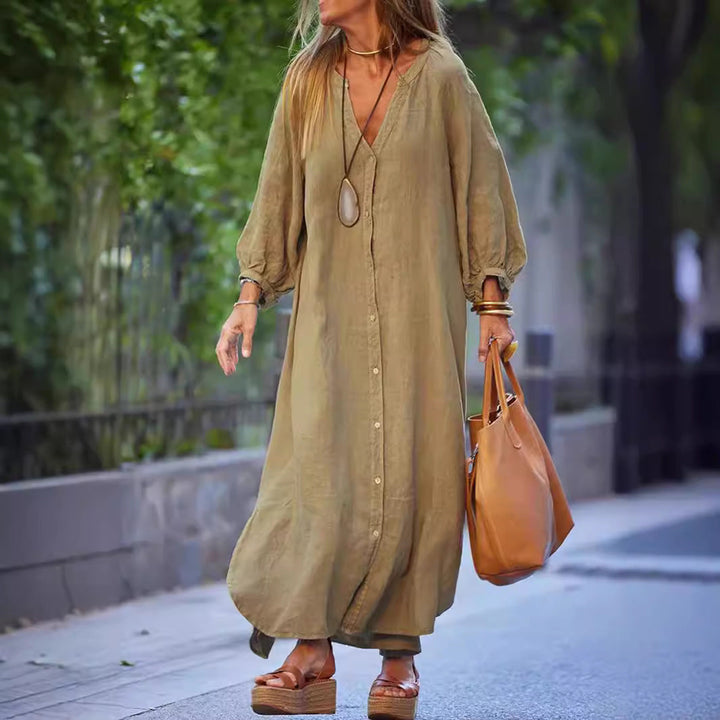 Women's V-neck summer dress with stylish puffed sleeves & full button-down front, perfect for beachwear.