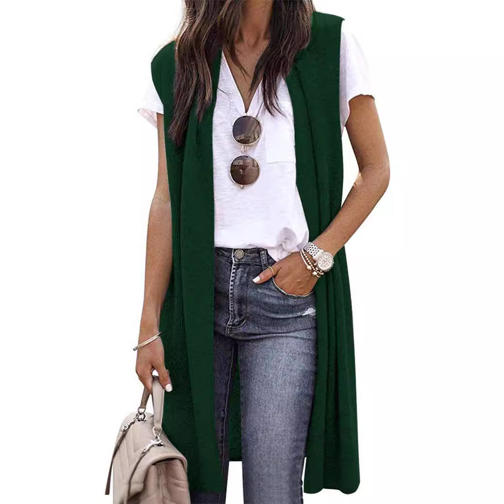 Women's elegant long vest paired with casual wear, creating a chic and modern layered look.