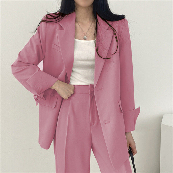 Modern women's elegant blazer, paired with sleek trousers for a complete outfit.
