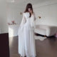 Women's formal tiered maxi dress with elegant bell sleeves, ideal for evening parties.