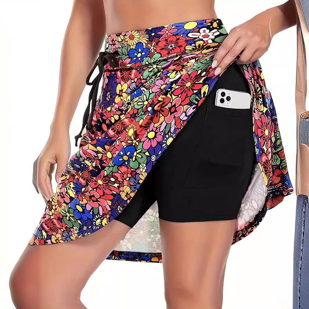 Women's tennis skirt, quick-dry, with built-in compression shorts & pockets. Versatile for running, gym, and active sports.