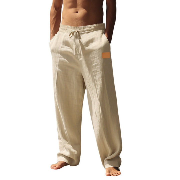Comfortable breathable men's beachwear pants with drawstring waist for warm weather.