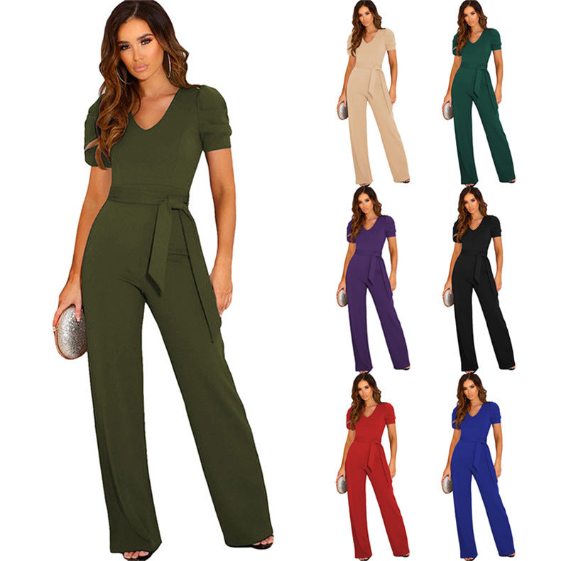 Elegant women's jumpsuit with stylish puff sleeves & flattering waist belt, perfect for evening wear.