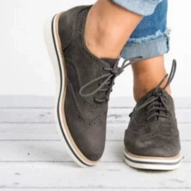 Stylish women's brogue dress shoes with a sophisticated perforated design, ideal for versatile classic footwear.