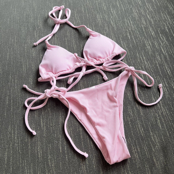 Modern striped tie-front bikini. A trendy women's swimwear choice for summer fashion & pool.