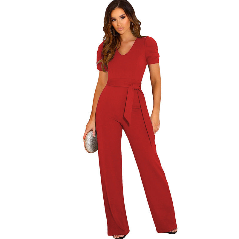 Sophisticated women's V-neck jumpsuit. An elegant one-piece with chic puff sleeves and a tailored waist belt.