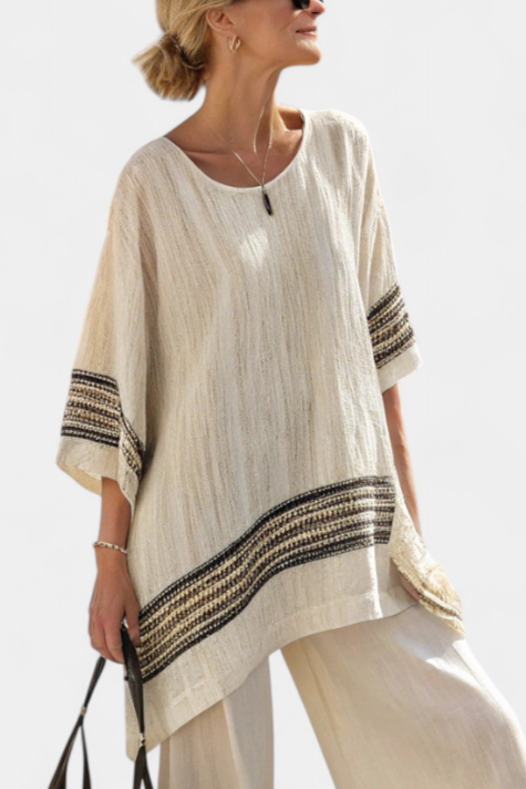 Casual chic women's two-piece set featuring a multi-colored striped top & comfortable flowing pants for spring.