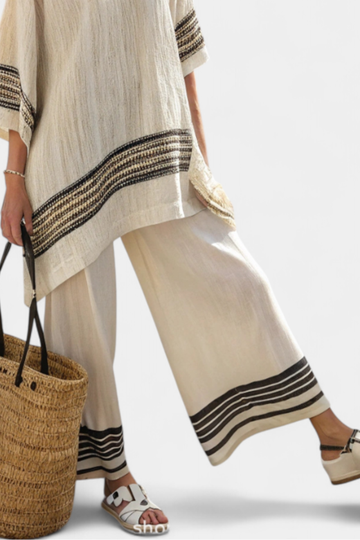 Elegant women's striped top & flowing pants set. A stylish summer outfit or resort wear for any vacation.