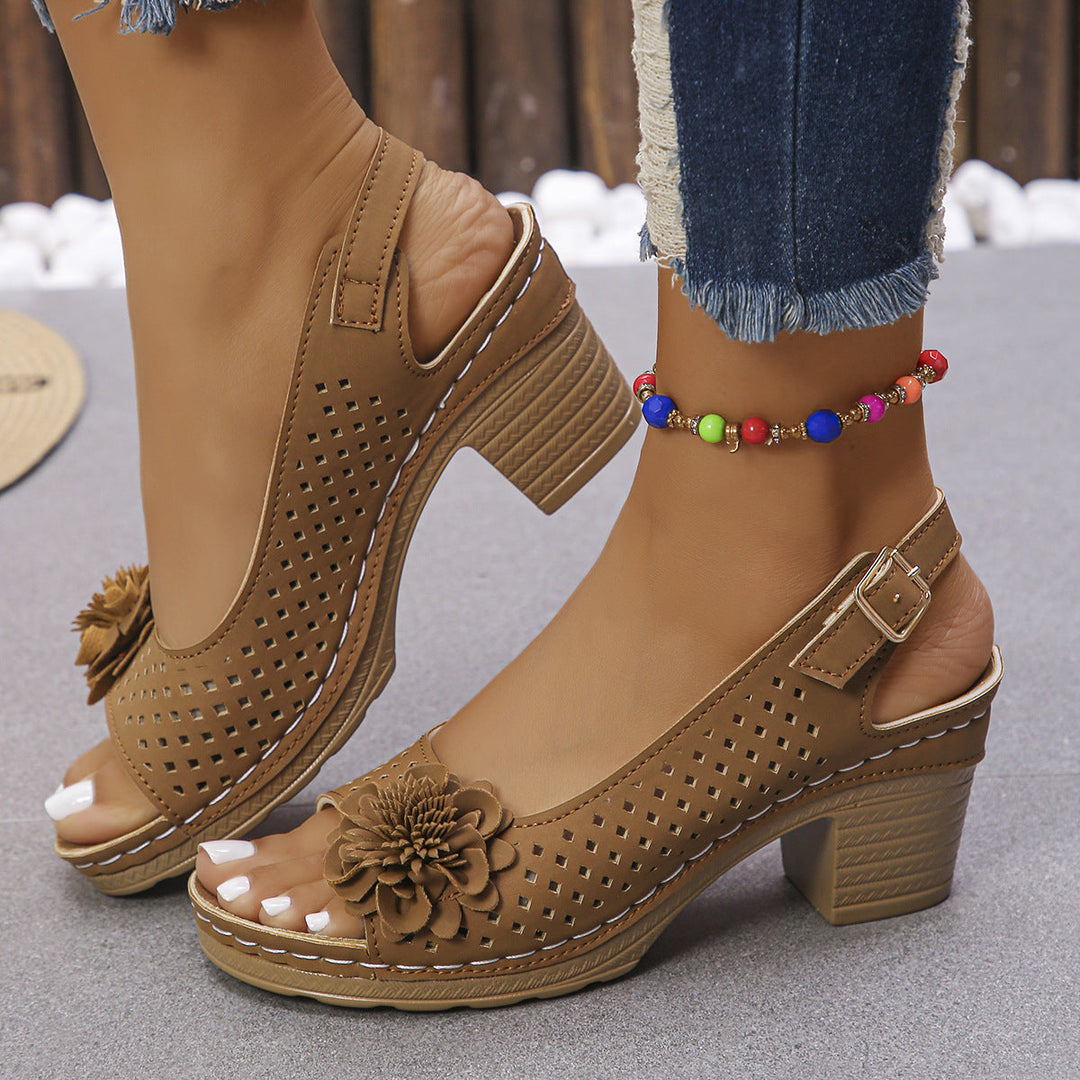 Women's comfort sandals with breathable design, elegant floral detail, and cushioned sole for summer wear.